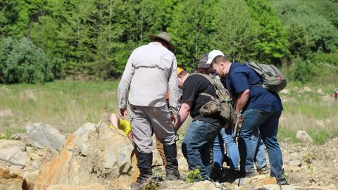 Students study a reclaimed mine